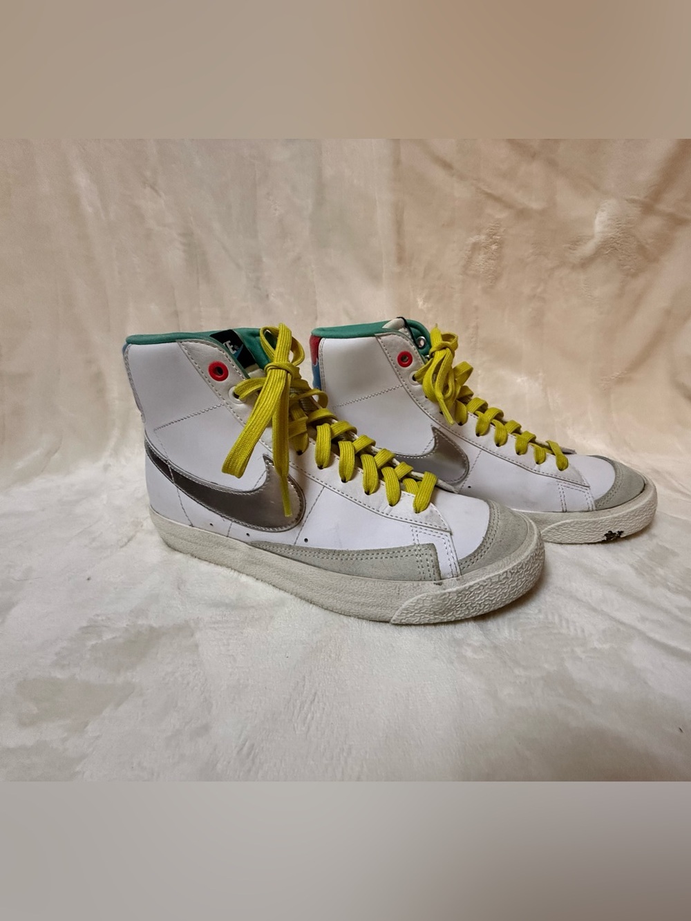 White High-Top Sneakers with Yellow Laces and Silver Swoosh